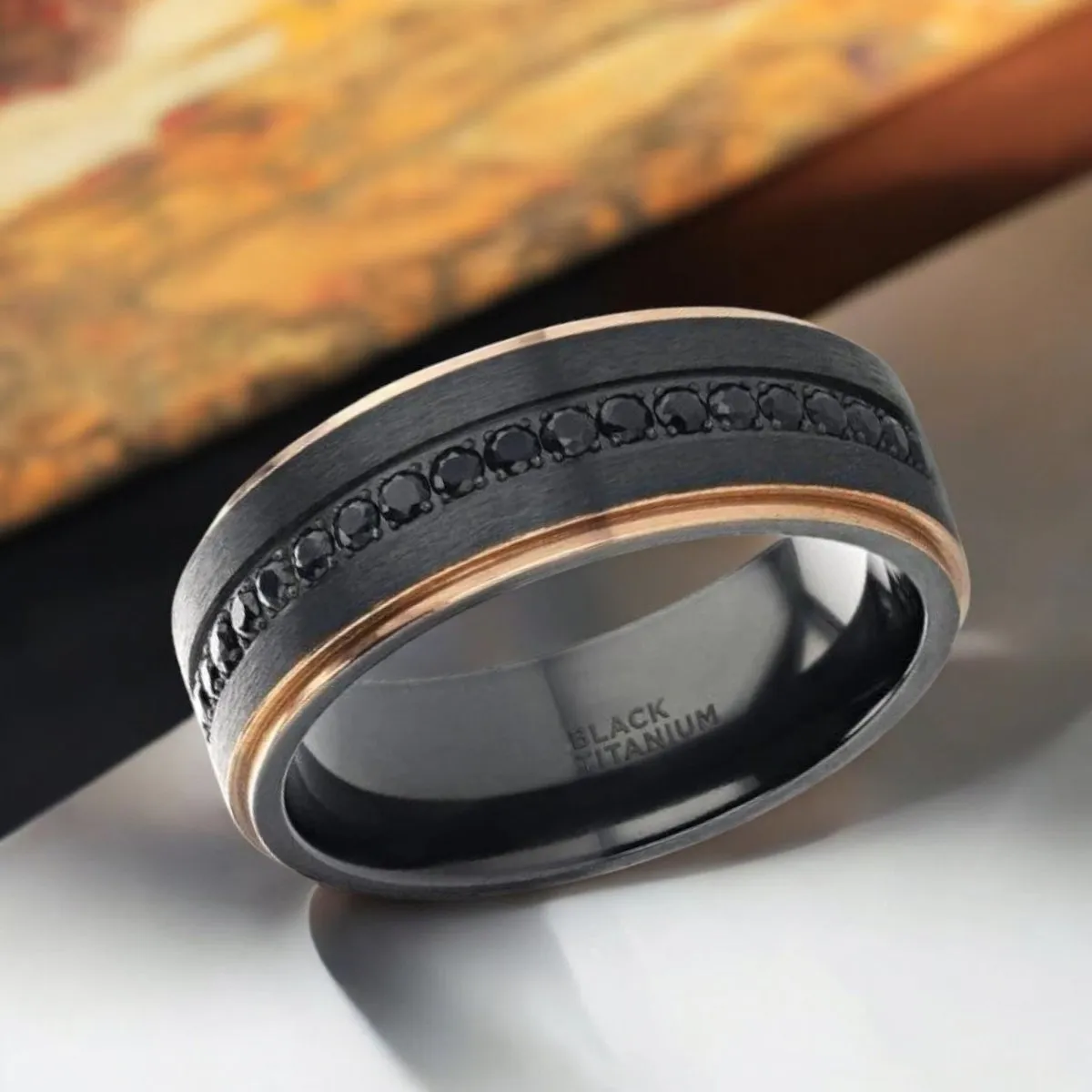 ASTRO | Black Titanium Ring, Sapphire Stones, Rose Gold Stepped Edges
