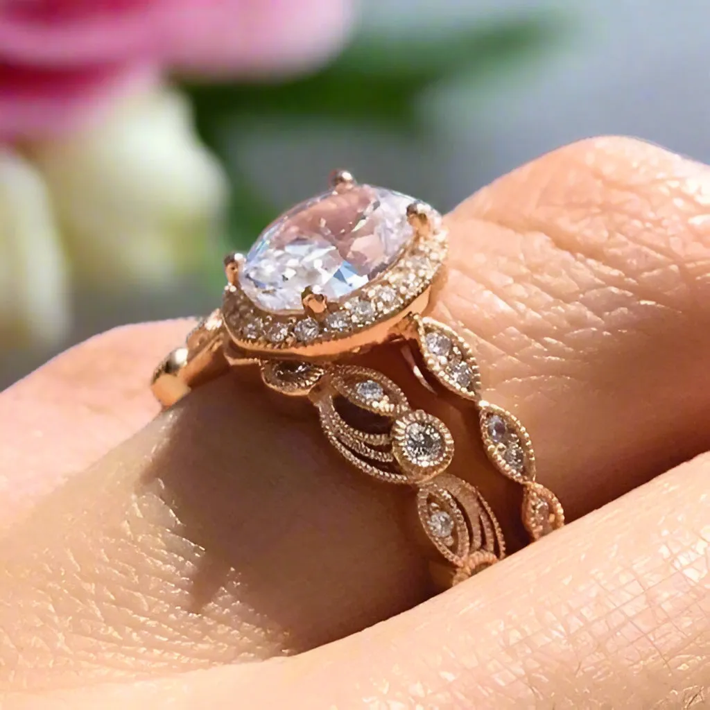 Oval Cut Clear Stone Halo Wedding Ring Set in Rose Gold