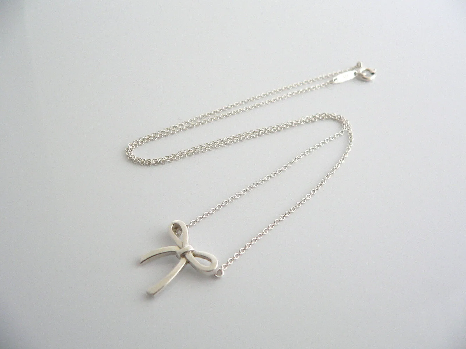 Tiffany & Co  Silver Ribbon Bow Necklace Pendant Charm Chain Gift Love